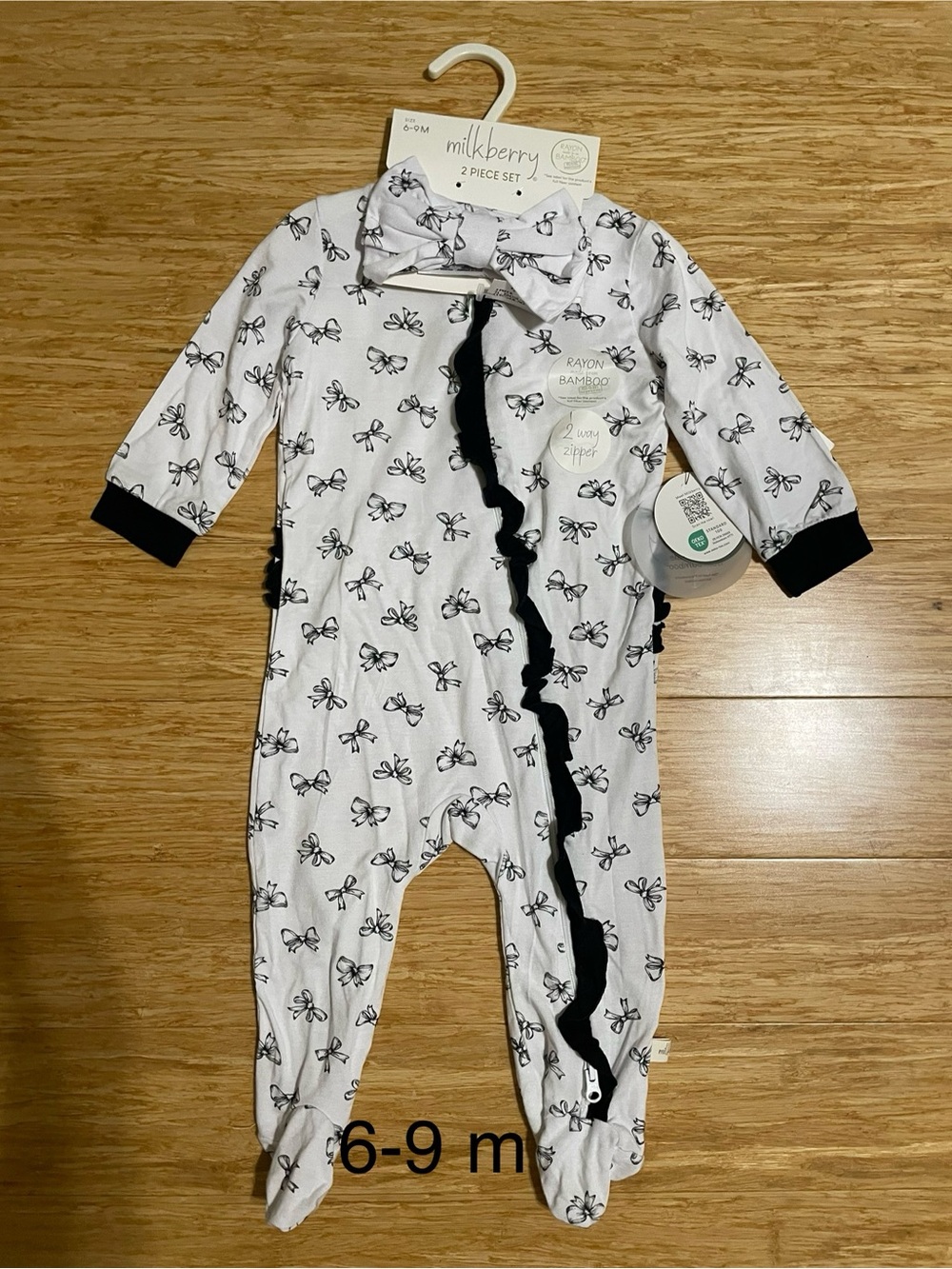Milkberry White and Black Bow-Print Footed One-Piece for Babies